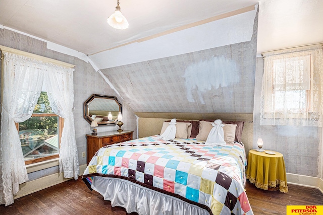 bedroom featuring dark hardwood / wood-style flooring and vaulted ceiling