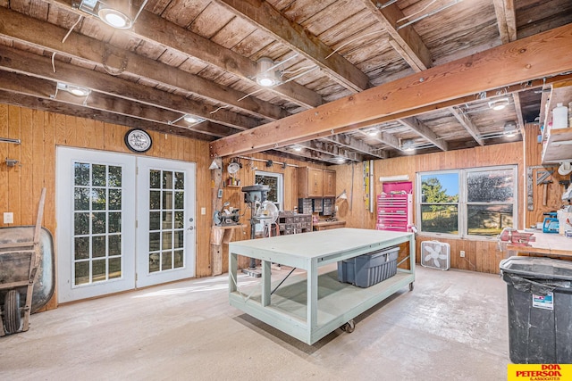 recreation room with french doors, wooden walls, beam ceiling, and wooden ceiling