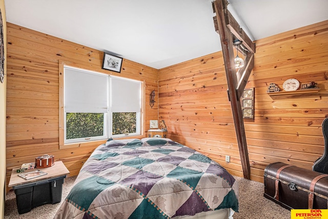 bedroom with wooden walls and carpet flooring