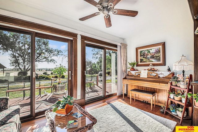 sitting room featuring ceiling fan and hardwood / wood-style flooring