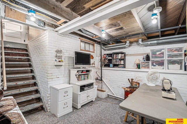 basement with brick wall