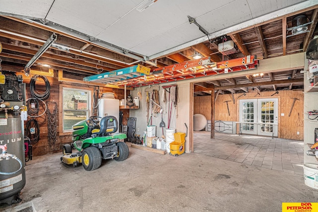 garage featuring a garage door opener and french doors