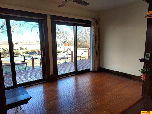 interior space featuring ceiling fan and access to outside