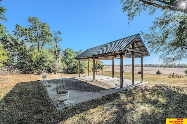 view of yard with a rural view, a gazebo, and a patio area