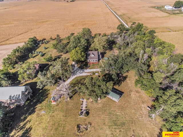 birds eye view of property with a rural view