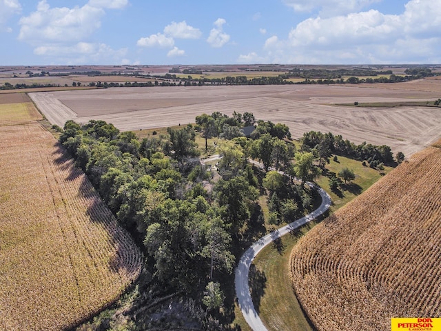 birds eye view of property with a rural view