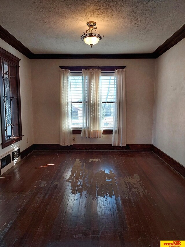 bedroom featuring a textured ceiling, ornamental molding, and dark hardwood / wood-style flooring