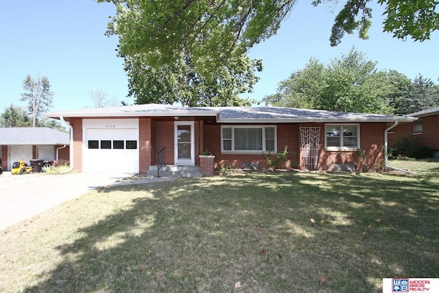 single story home with a front lawn and a garage