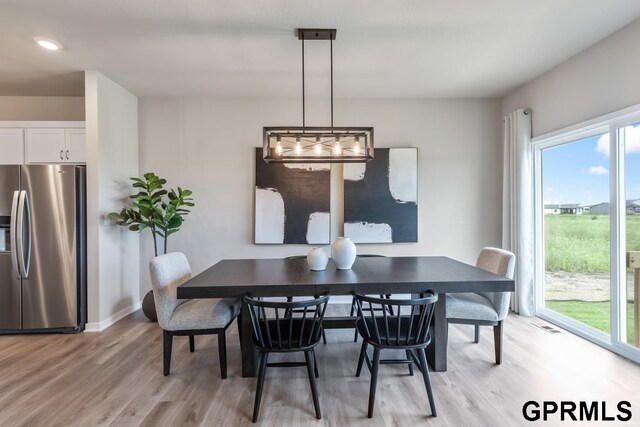 dining room featuring light hardwood / wood-style flooring