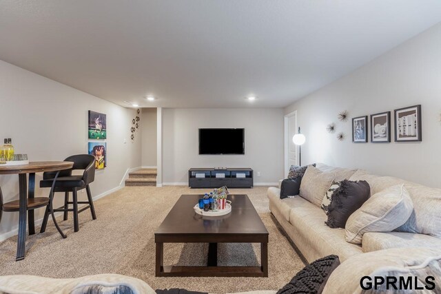 living room with light colored carpet