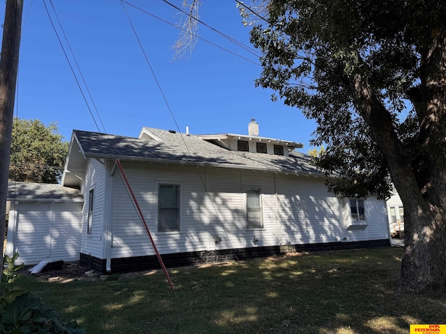 view of side of property with a yard