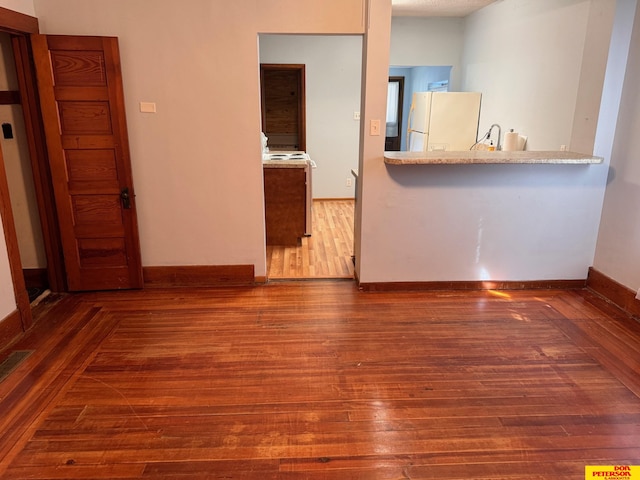 interior space with dark hardwood / wood-style flooring