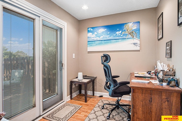 home office with light wood-type flooring