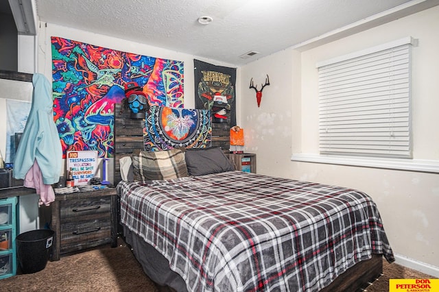 carpeted bedroom with a textured ceiling