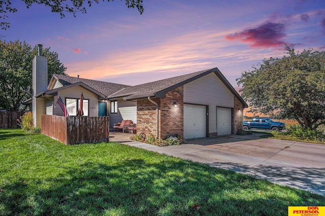 ranch-style house featuring a lawn