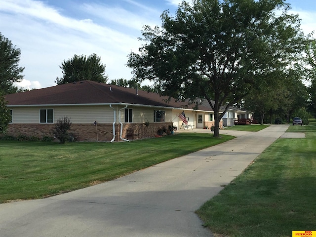 view of home's exterior with a lawn