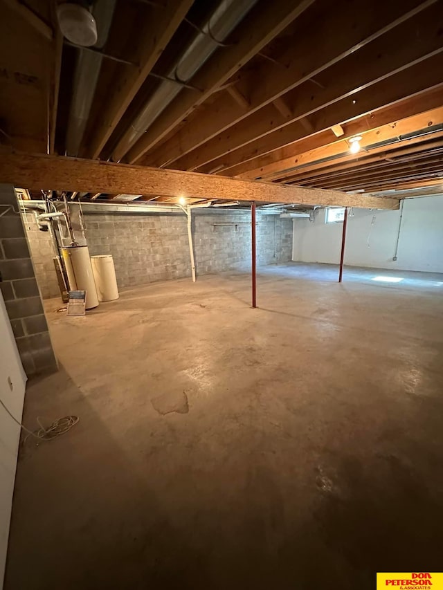 basement featuring water heater