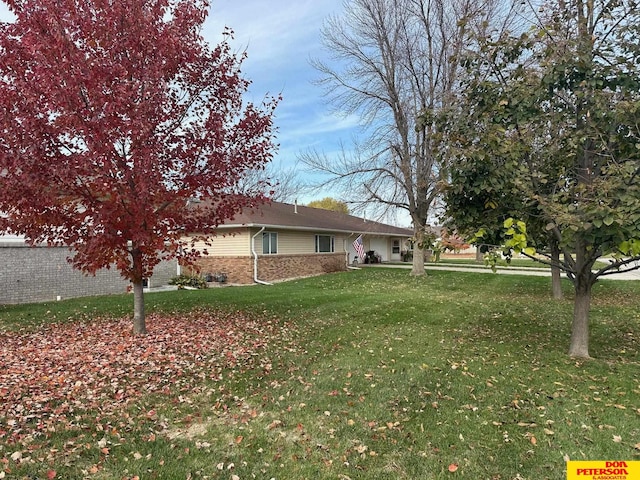 view of property exterior featuring a lawn