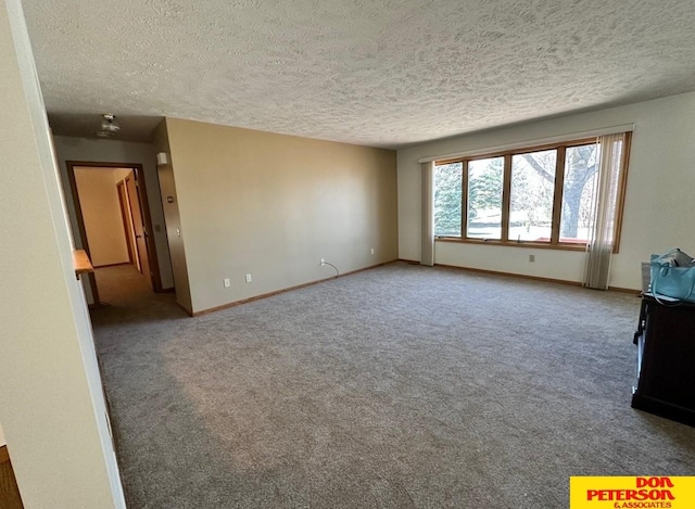 unfurnished living room with a textured ceiling and carpet floors