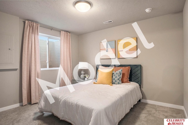 bedroom featuring electric panel, a textured ceiling, visible vents, baseboards, and carpet floors