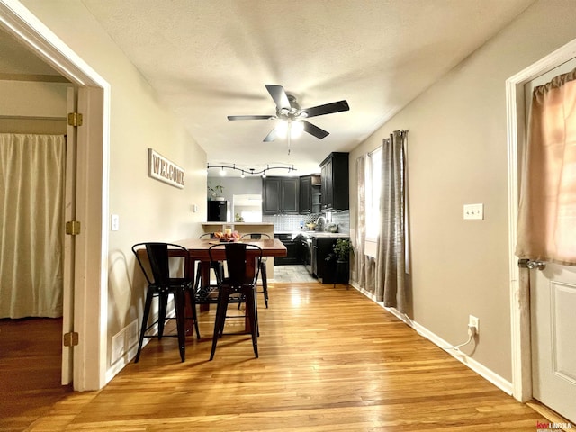 3800 SW 16th St, Lincoln, NE 68522 - dining room with light wood-style flooring, baseboards, and ceiling fan
