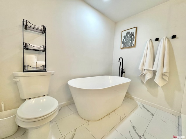 3800 SW 16th St, Lincoln, NE 68522 - bathroom with toilet, baseboards, and a soaking tub