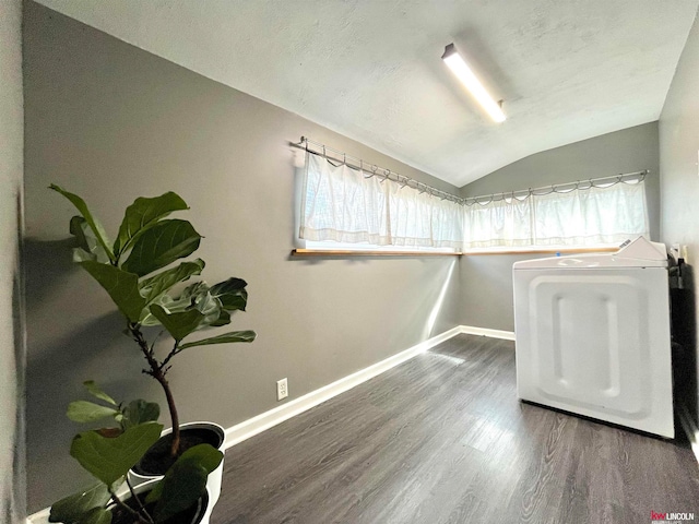 interior space with plenty of natural light, dark wood-type flooring, and washer / dryer