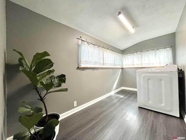 3800 SW 16th St, Lincoln, NE 68522 - unfurnished room featuring baseboards, washer / dryer, vaulted ceiling, and wood finished floors