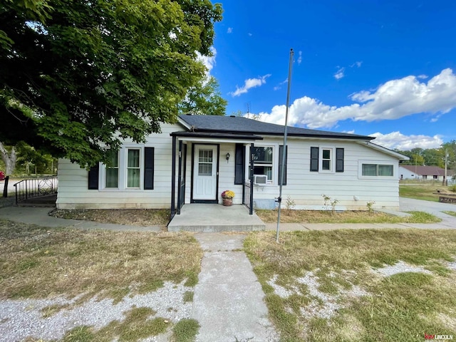 3800 SW 16th St, Lincoln, NE 68522 - view of front of house featuring fence, cooling unit, and covered porch