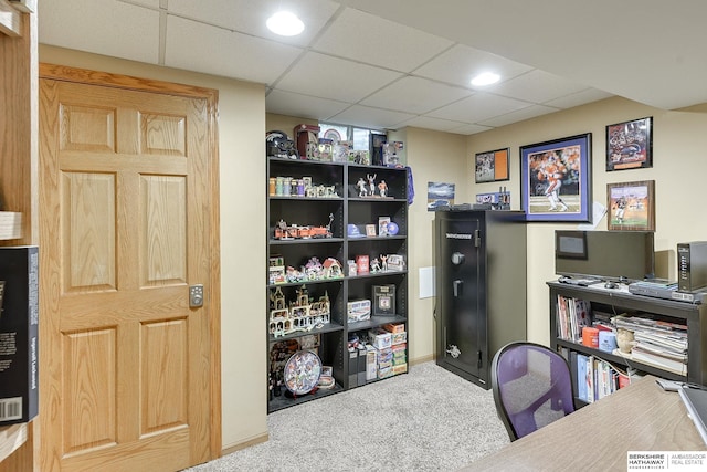 office area with carpet flooring and a drop ceiling