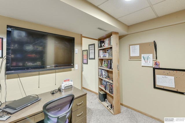 home office with a drop ceiling and light carpet