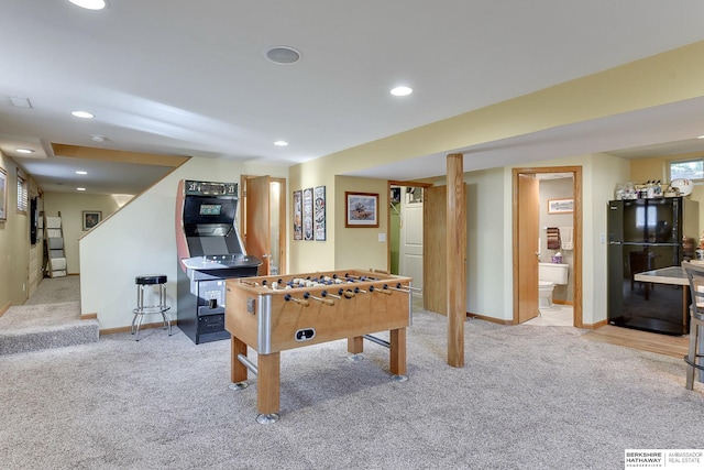 rec room with light carpet