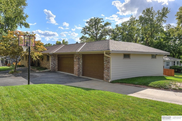 view of front of house with a front yard and a garage