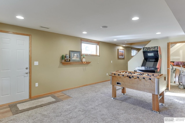 playroom featuring light carpet