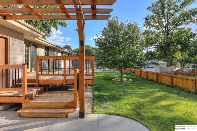 view of yard featuring a pergola and a deck