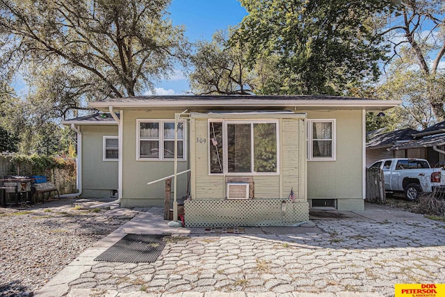 rear view of house featuring a patio