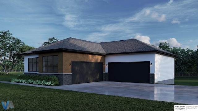 view of front of house featuring a garage and a front lawn