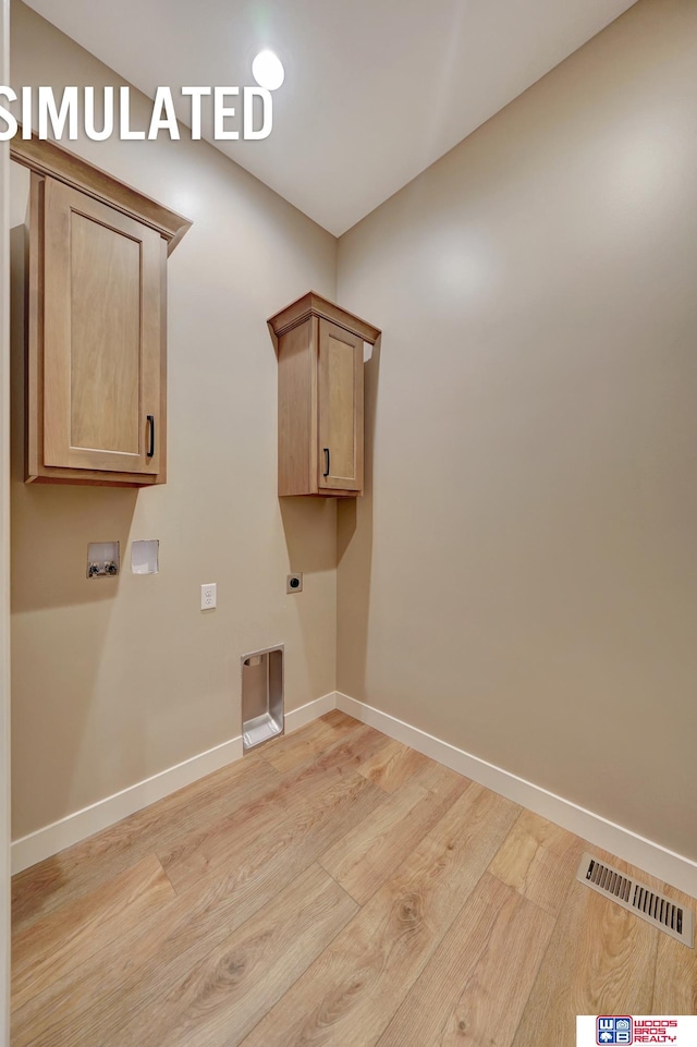 laundry room featuring cabinets, washer hookup, light wood-type flooring, and electric dryer hookup