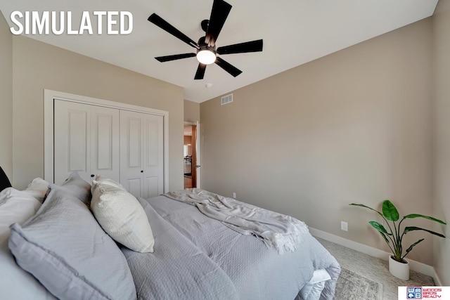 carpeted bedroom with ceiling fan and a closet