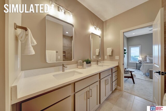 bathroom featuring tile patterned flooring and vanity