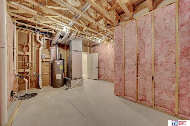 basement featuring electric water heater and heating unit