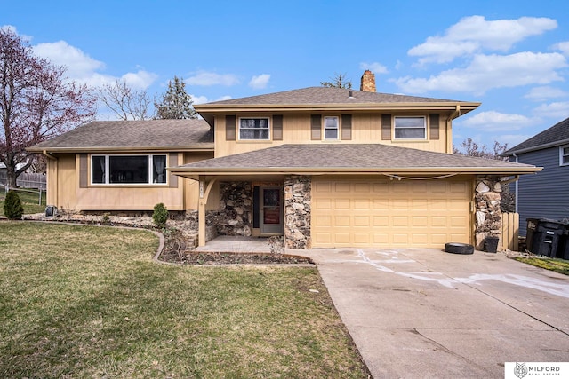 view of front of property featuring a front lawn and a garage