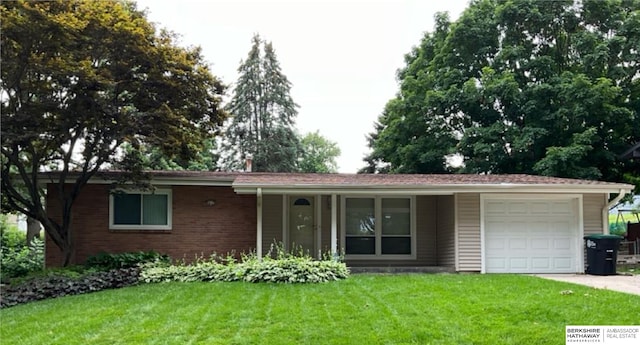 ranch-style house featuring a porch, a garage, and a front yard