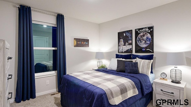 bedroom featuring light colored carpet