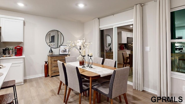 dining room with light wood-type flooring