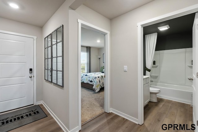 doorway with hardwood / wood-style floors