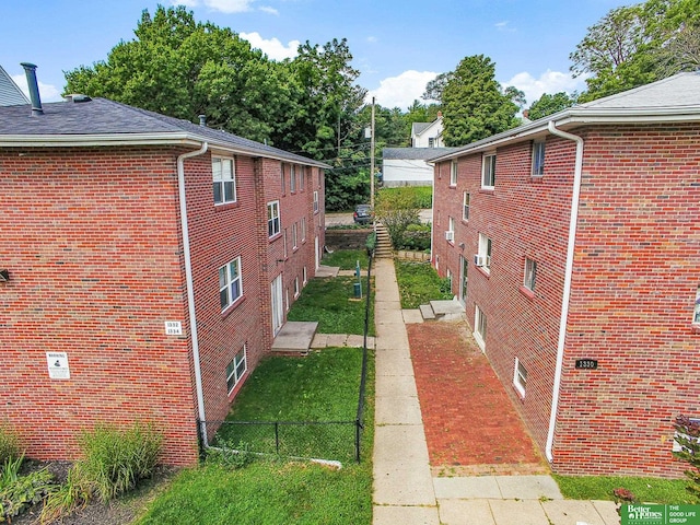 view of property exterior with a yard