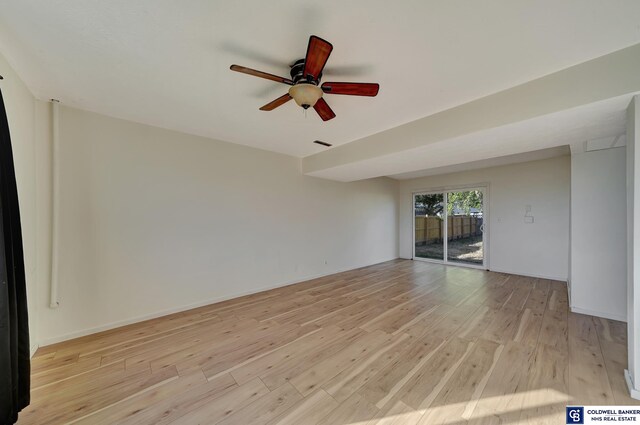 empty room featuring light wood-type flooring and ceiling fan