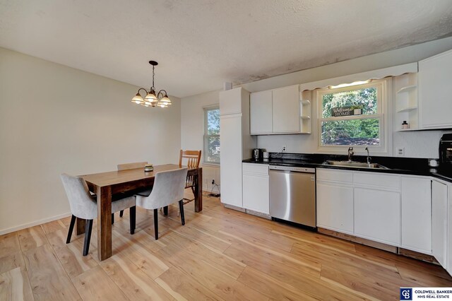 kitchen with dishwasher, light hardwood / wood-style flooring, and white cabinets