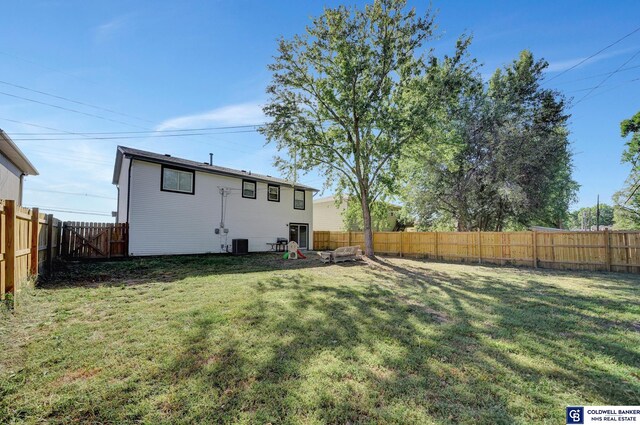 exterior space featuring a lawn and central air condition unit